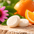 Orange flavour lozenges close-up